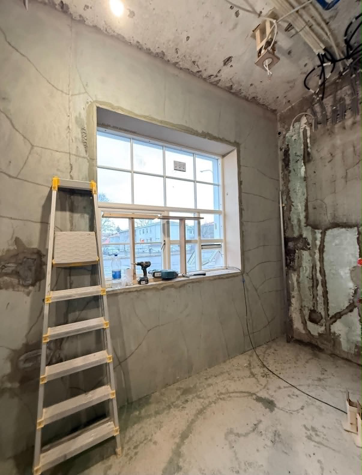 Bedroom — before, bare walls with new window installed