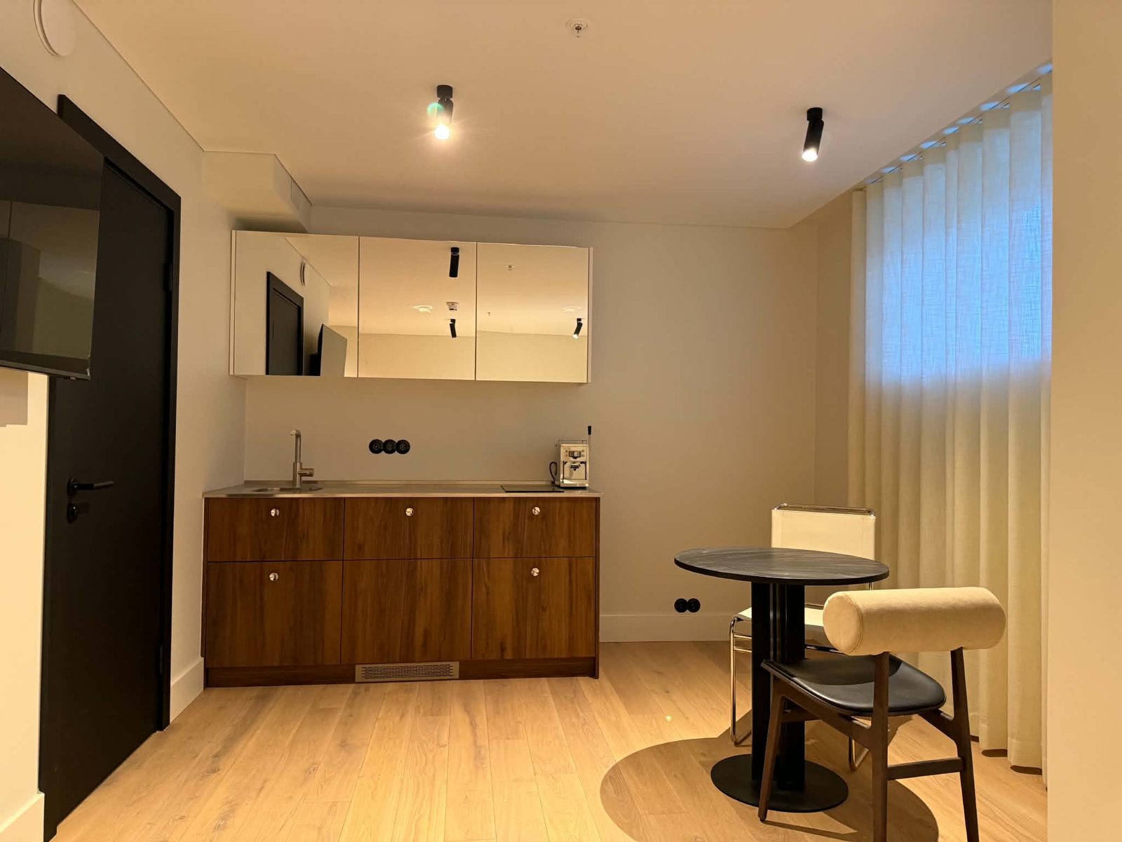 Kitchen — after, walnut cabinets with mirrored upper units