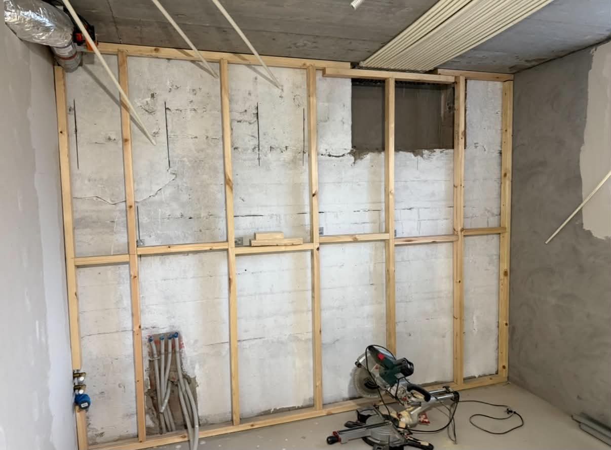 Kitchen — before, timber wall framing in progress